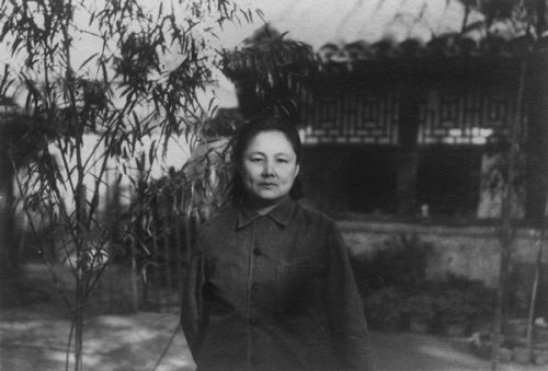 Lao Lao in front of her house
